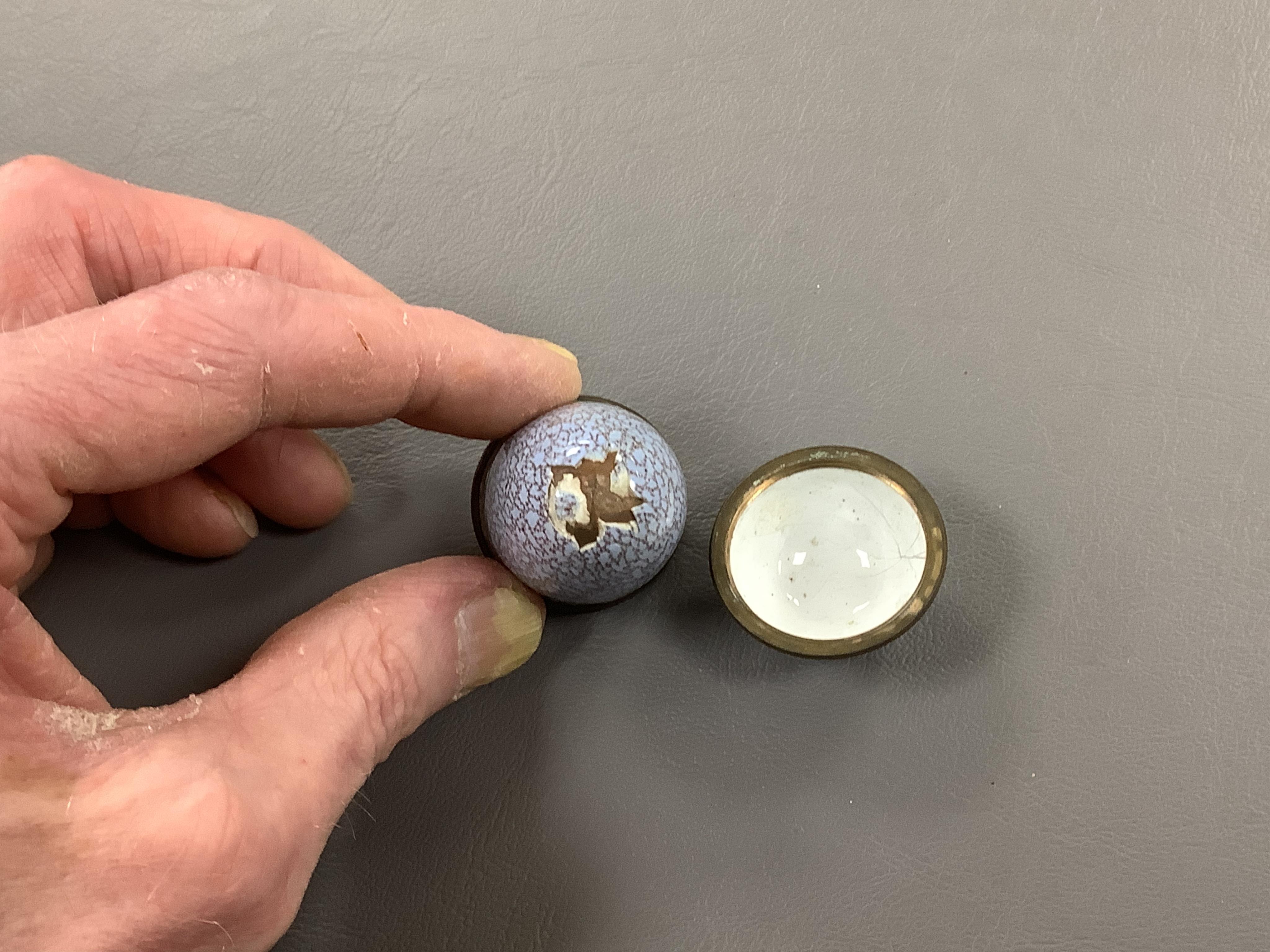 A collection of seven late 18th / early 19th century South Staffordshire enamel patch and snuff boxes and a continental porcelain snuff box, Largest 3.5cm high (8)